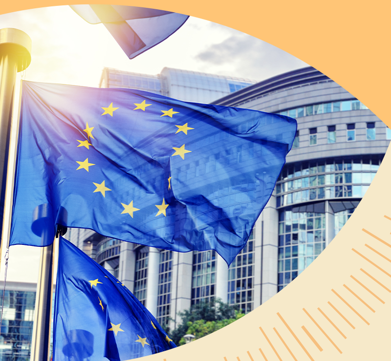 European Union flag flying outside a modern government building