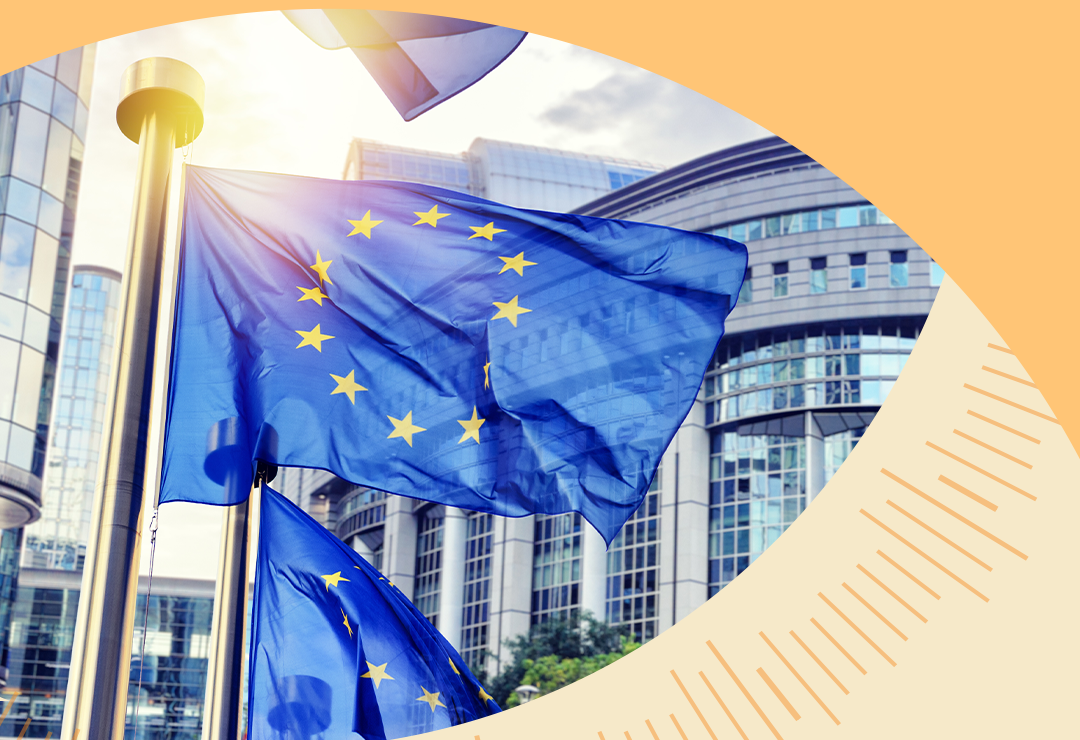 European Union flag flying outside a modern government building